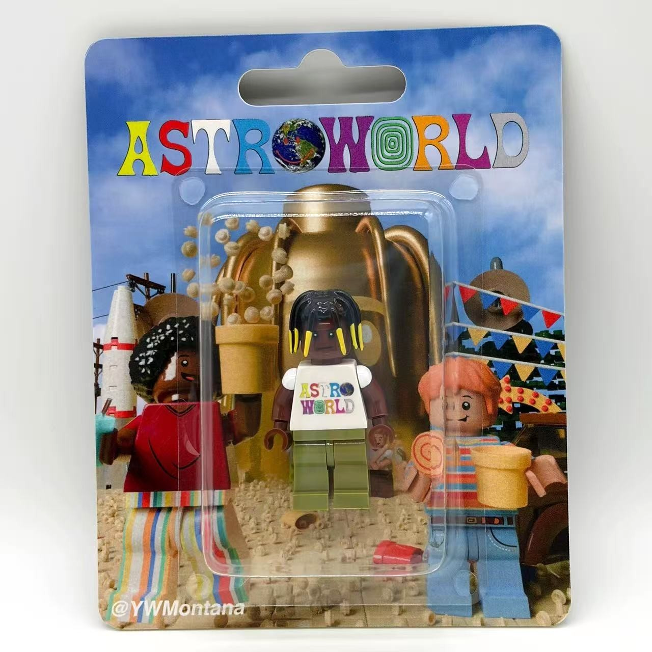 Travis Scott Astroworld Custom Minifigure features a vibrant Astroworld tee, packaged in a colorful blister pack.
