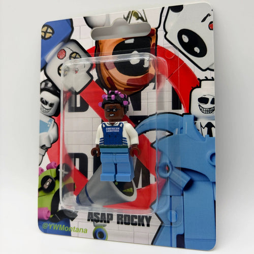 A$AP Rocky custom minifigure in blue "American Sabotage" vest with purple hair, blister pack display.