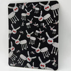 Drake "For All The Dogs" minifigure packaging with artistic dog pattern, black background, vibrant red accents.