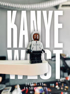 Kanye West "Vultures Shanghai 2025" minifigure in white hoodie with "SZNX" graphic, black pants, face mask.